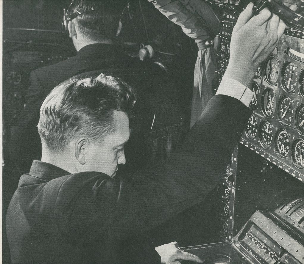 1956 A flight engineer at the controls of a Pan Am Boeing 377 Stratocruiser.